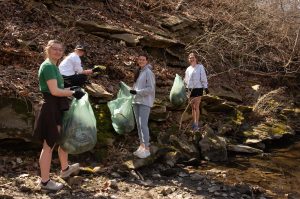 Volunteers picking up trash and litter from Flat Branch Creek.